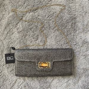 Gray bag with gold chain.